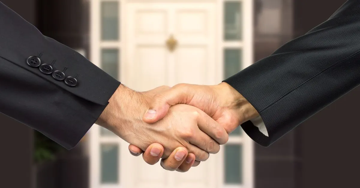 aperto de mãos representando acordo e responsabilidade civil em casos de vendedor que some após receber o pagamento